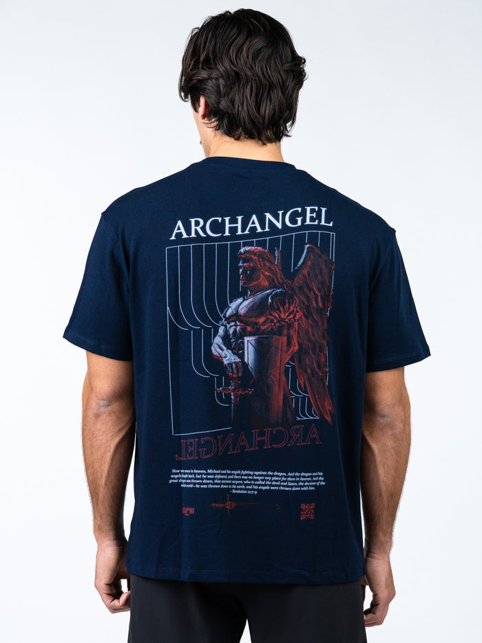 Person wearing a navy blue t-shirt with 'Archangel' graphic design on the back.