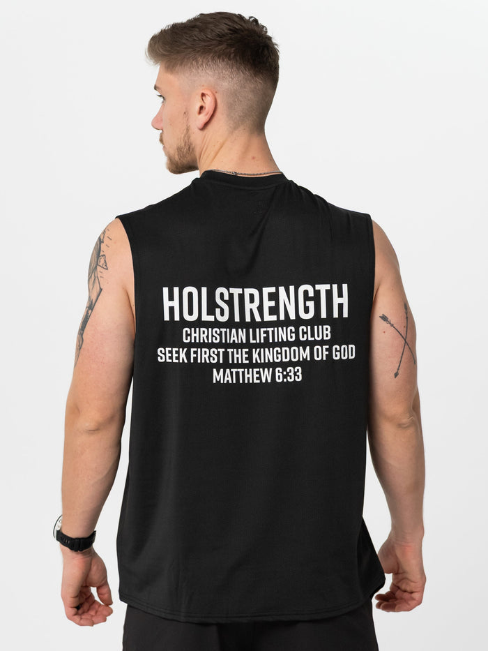 Person wearing a black sleeveless shirt with 'Holstrength' text on the back, standing against a white background.