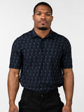Man wearing a black Cross Premium Polo shirt patterned with subtle gray crosses, paired with black pants, standing against a plain white background.