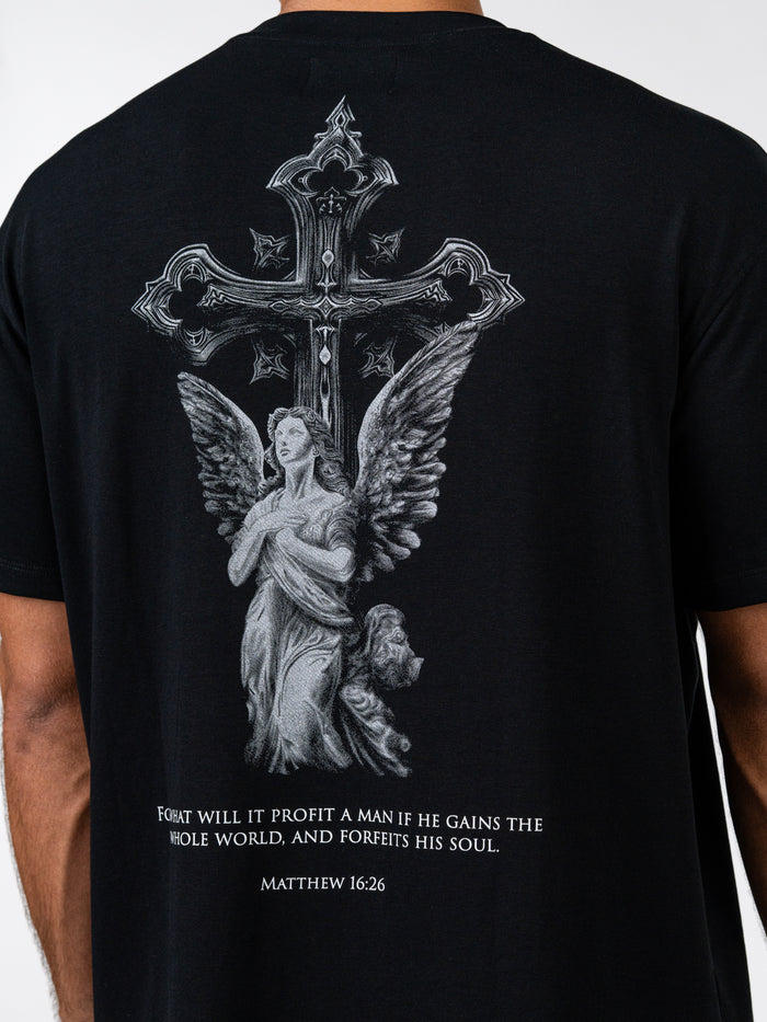 Black t-shirt with an angel and cross design on the back, featuring a biblical quote.