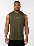 Man wearing an olive green Essential Sleeveless Hoodie featuring a small Christian cross with a barbell design on the chest, paired with black athletic shorts.