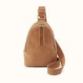 A tan suede shoulder bag with a top zipper, drawstring detail, and a matching adjustable shoulder strap, shown against a plain white background.