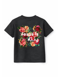 Back view of a black Jesus is King Youth Tee featuring a vibrant floral design with red, pink, and orange roses surrounding the bold white text "Jesus is King," blending faith based apparel with stylish Christian gym clothing appeal.