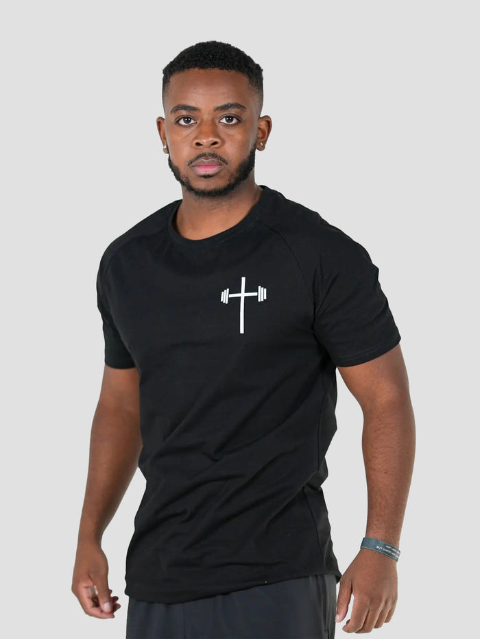 Man wearing a black t-shirt with a white logo, front view