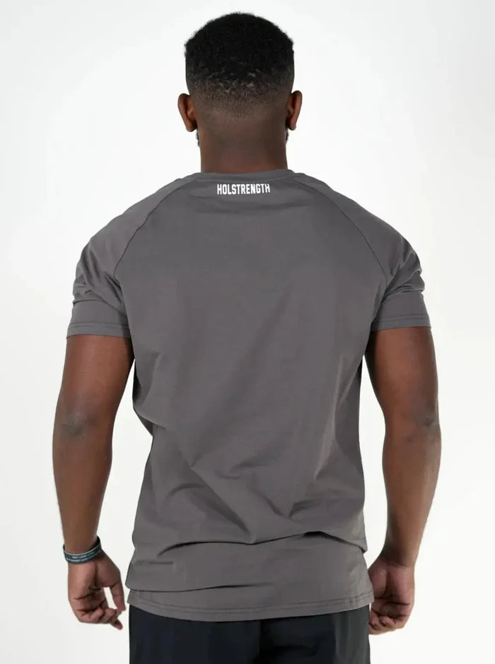Man wearing a Iron t-shirt with a white logo, back view