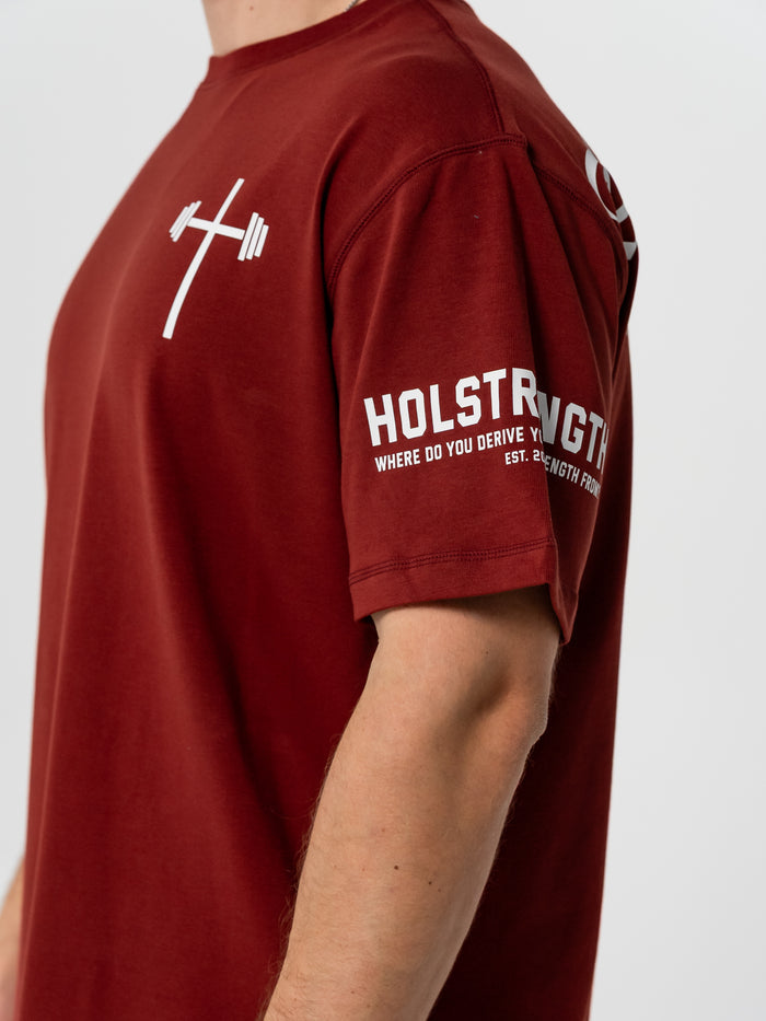 Maroon t-shirt with white text and logo on a plain background