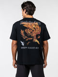 Back view of a man wearing a black Seek the Lord Premium Oversized Tee featuring a large graphic of an eagle in flight, text "Seek the Lord", and Isaiah 40:31 scripture reference.