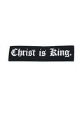 Black Velcro Patch with white text reading "Christ is King" in a classic Gothic font, designed for Christian fitness apparel or activewear.